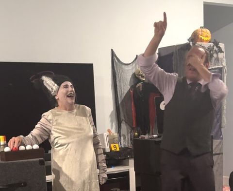 Eric Kurit performing on stage at a holiday party