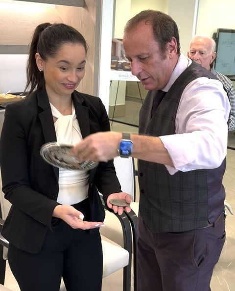 Eric Kurit performing close-up magic for guests at a corporate event